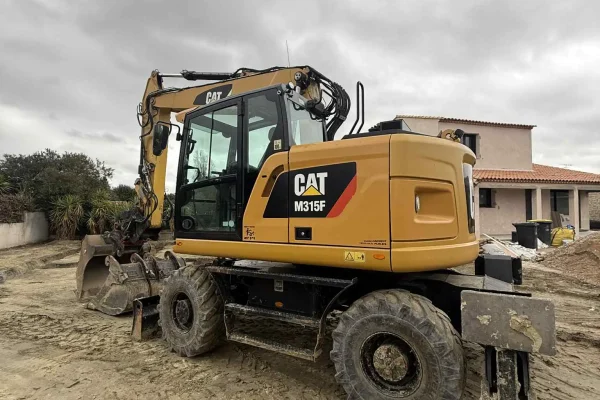 PELLE SUR PNEUS CAT M315 ROTOTILT 15 TONNES TILTROTATOR
